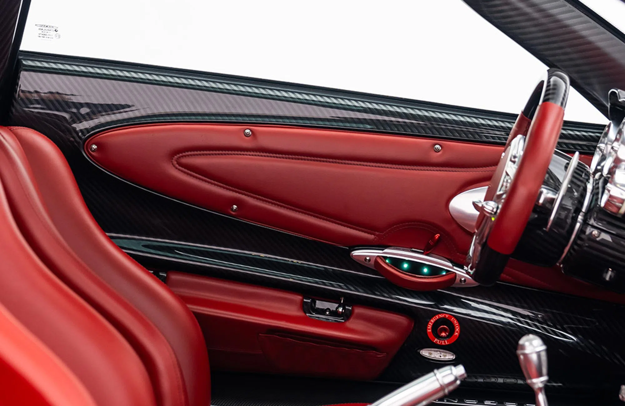 2014 Pagani Huayra Carbon Edition interior, door panel, Hand-stitched red leather