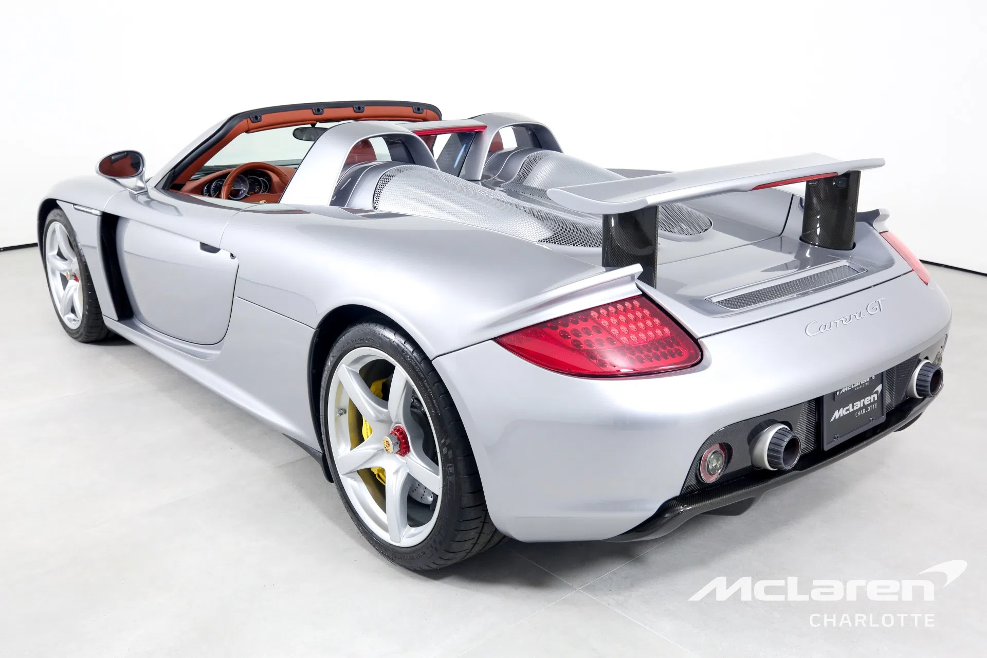 2004 Porsche CARRERA GT, rear three-quarter view, GT Silver Metallic