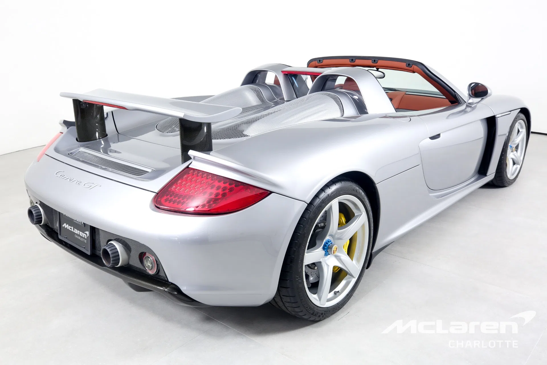2004 Porsche CARRERA GT, rear three-quarter view, GT Silver Metallic