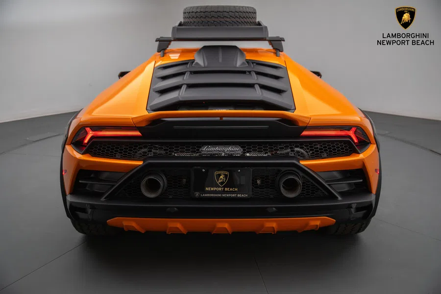 2023 Lamborghini Huracán Sterrato, rear three-quarter view, Arancio Borealis