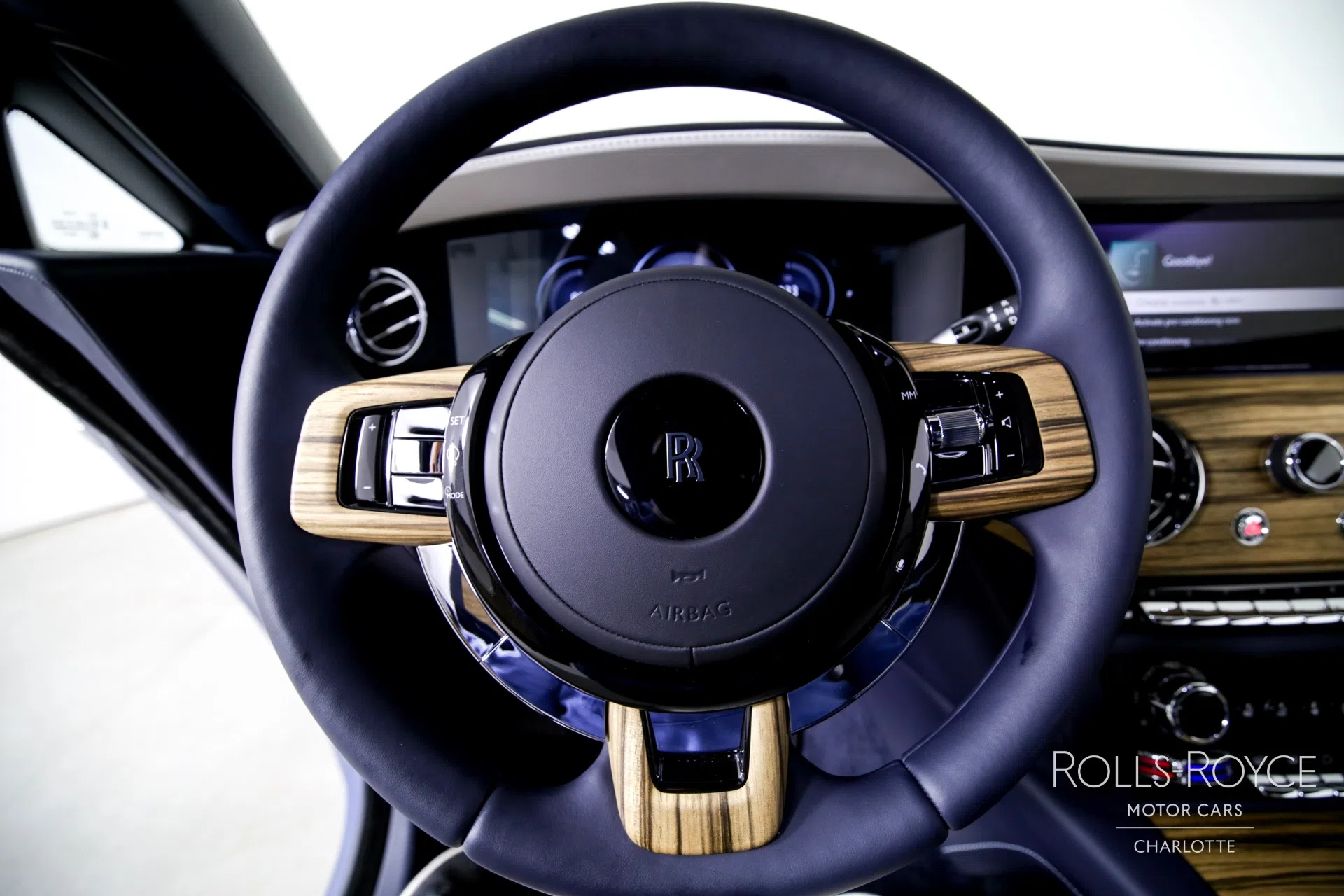 2024 Rolls-Royce Spectre interior, steering wheel, Grace White/Navy Blue/Charles Blue