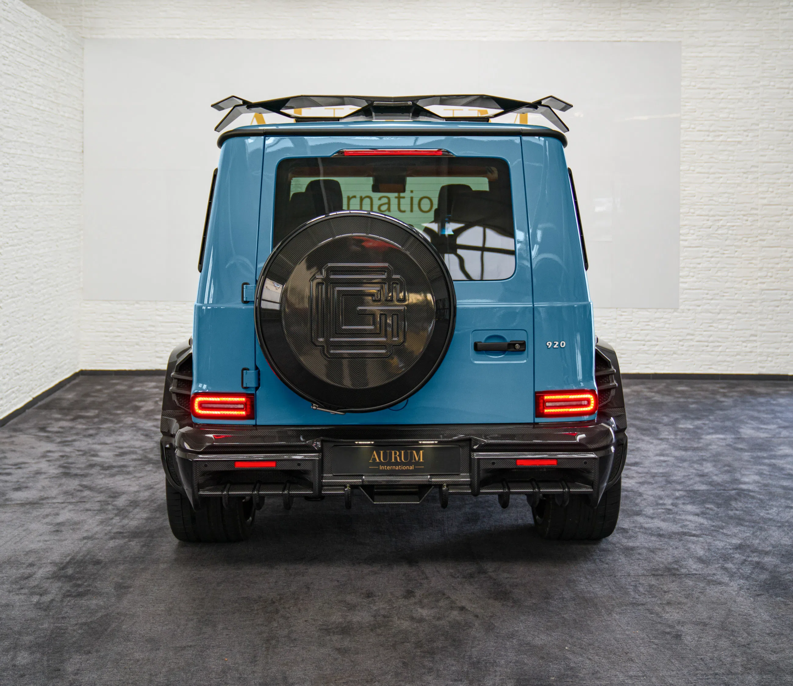 2024 Mercedes-Benz G 63 AMG GCD 920, rear three-quarter view, China Blue