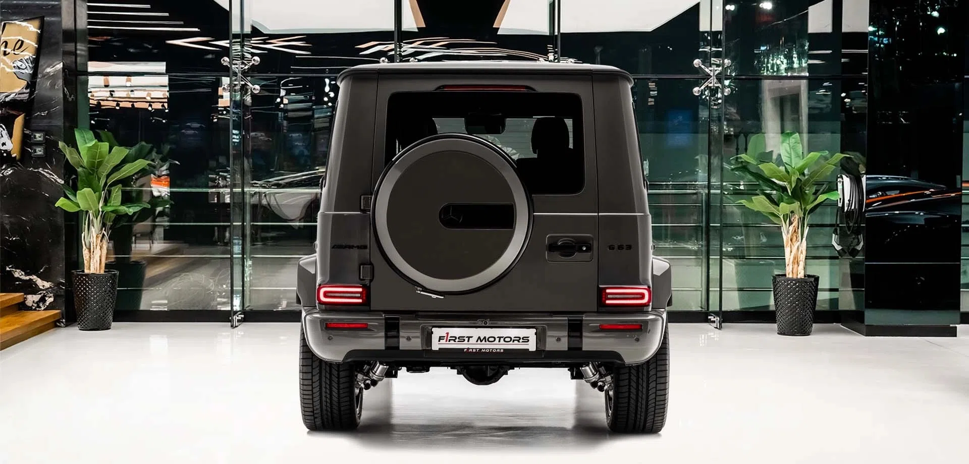 2025 Mercedes-Benz AMG G63, rear three-quarter view, Classic Grey