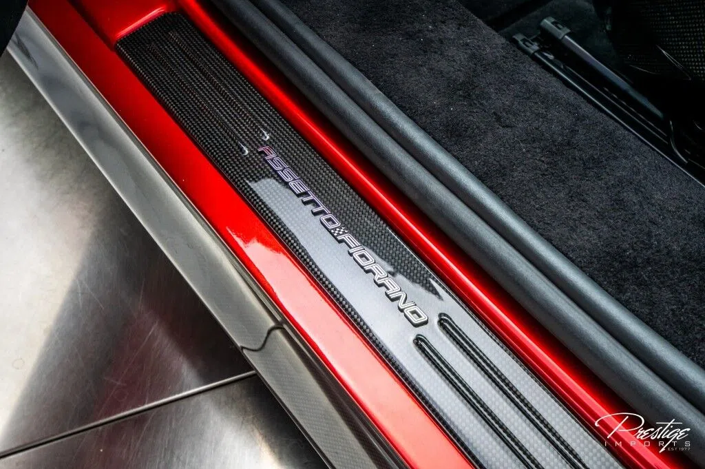 2023 Ferrari SF90 Spider Atelier Assetto Fiorano interior, door sill, Azzurro Santorini