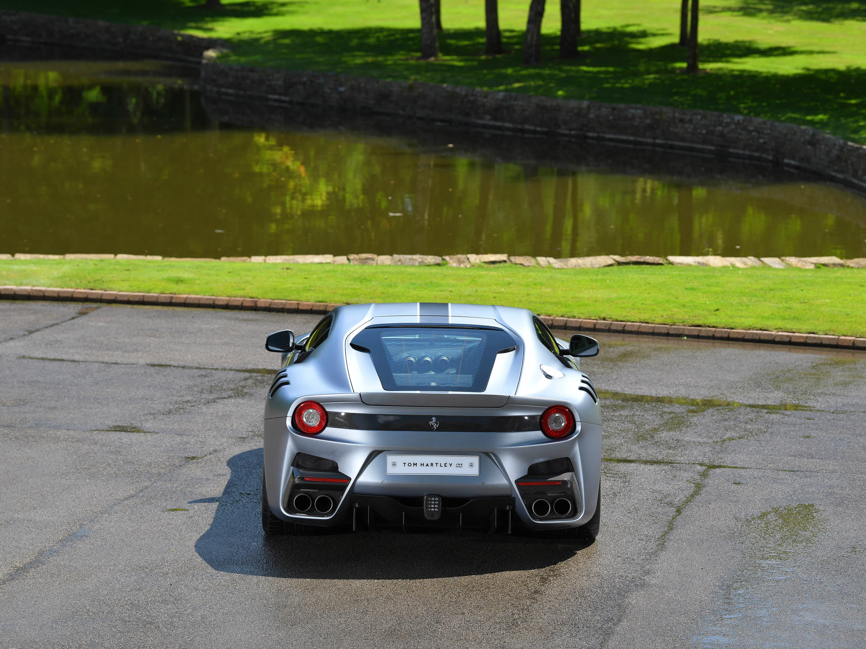 2017 Ferrari F12tdf, rear three-quarter view, Grigio Titanio Opaco