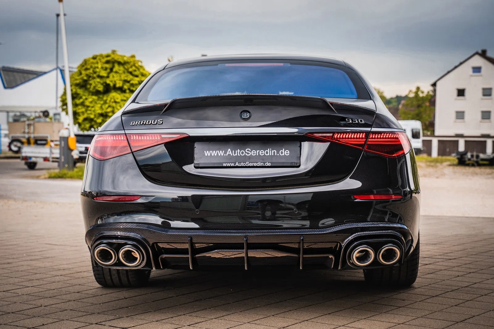 2024 BRABUS 930, rear three-quarter view, Obsidian Black | metallic
